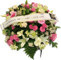 Coussin floral de deuil fuchsia, rose et blanc